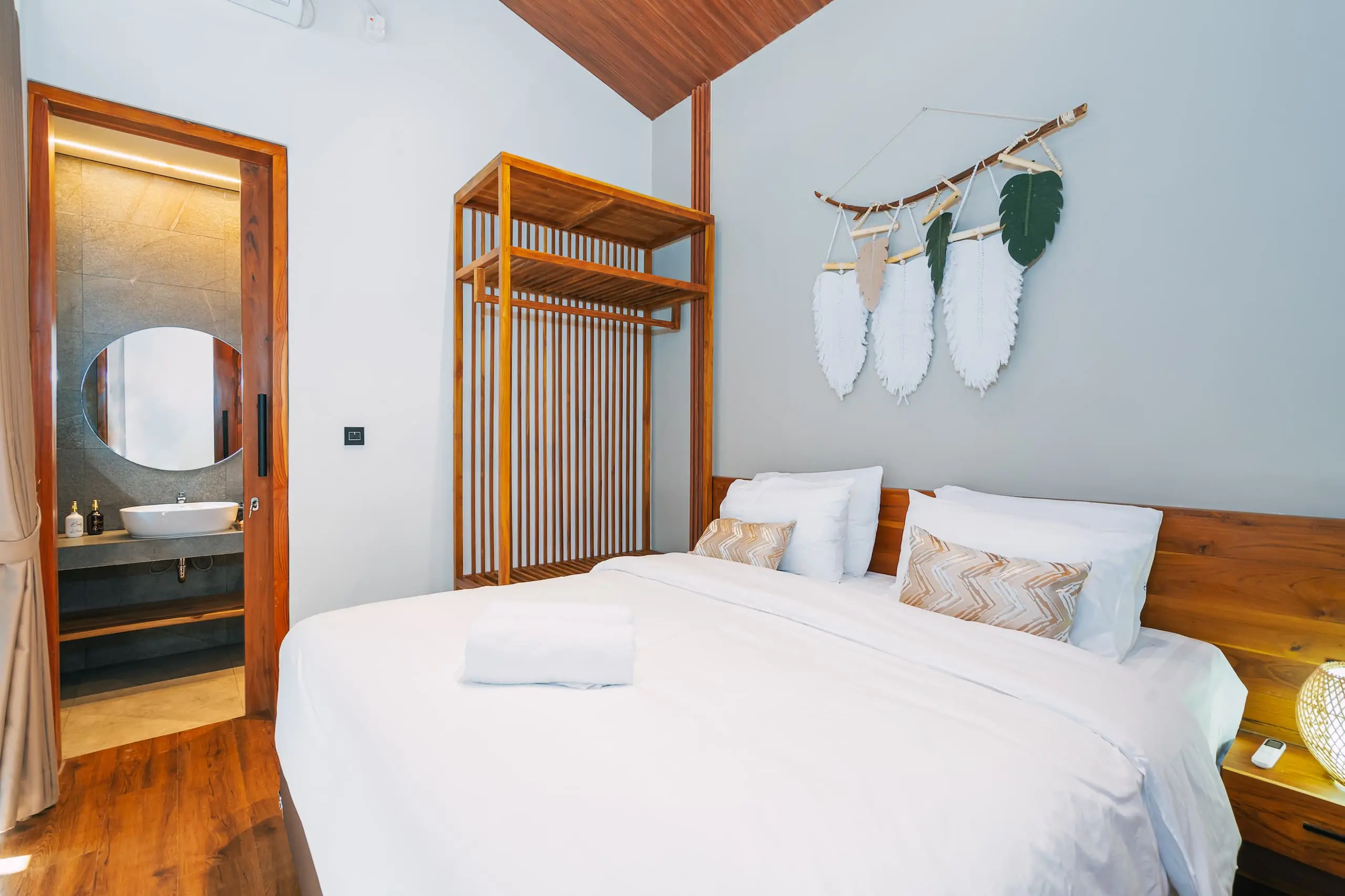 Luxury comfortable bedroom at Nirav Villa in Uluwatu, Bali.