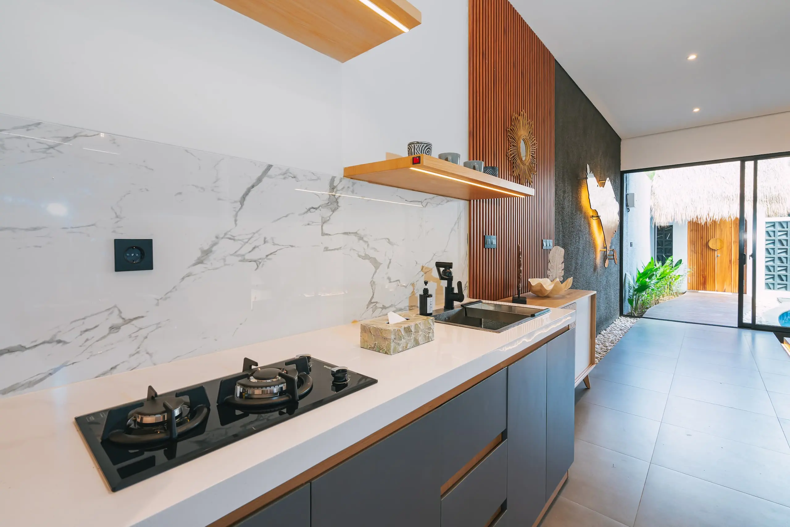 Luxury kitchen with many amenities at Nirav Villa in Uluwatu, Bali.